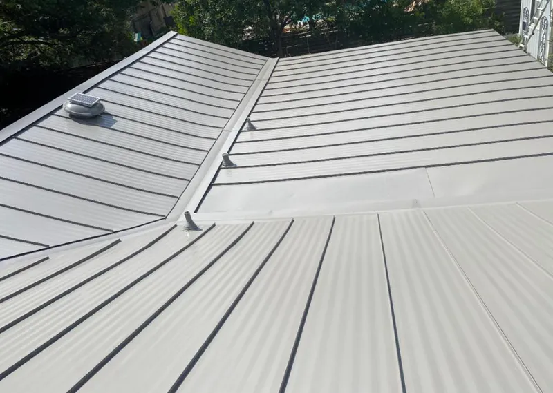 Solar attic fan installed on a metal roof for Roof Ventilation in Fussels Corner